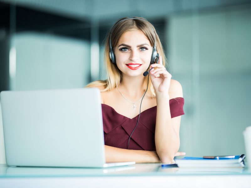 pretty female support center operator with headset